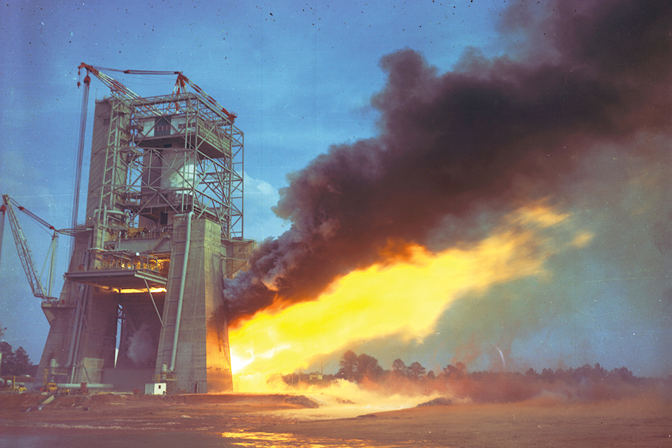 The five F-1 engines of a Saturn V’s S-IC first stage spew flame and smoke at Marshall Space Flight Center. (NASA)